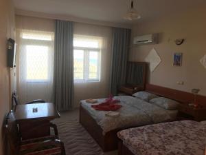 Postel nebo postele na pokoji v ubytování Hotel Grün