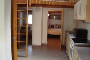a small kitchen with a bunk bed in a room at Kallista 1 in San-Giuliano