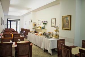 a dining room with a table and chairs at Albergo Umbria in Città di Castello