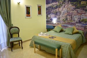 Tempat tidur dalam kamar di Hotel Ristorante Amitrano