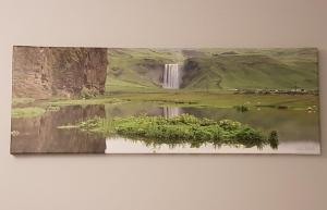 a painting of a waterfall and a body of water at Ubak Guesthouse in Reykjavík