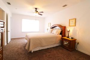 a bedroom with a large bed and a window at Big River Marina & Lodge in Astor