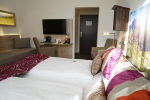 Postel nebo postele na pokoji v ubytování Hotel Edel Weiss