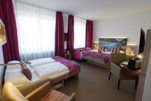 Postel nebo postele na pokoji v ubytování Hotel Edel Weiss
