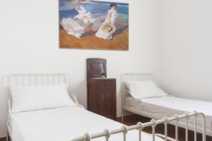 Postel nebo postele na pokoji v ubytování Casetta Canale delle Donne