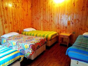 Postel nebo postele na pokoji v ubytování Hotel Catripulli