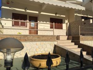 a building with a fountain in front of a building at Thalassa in Siviri +4 photos