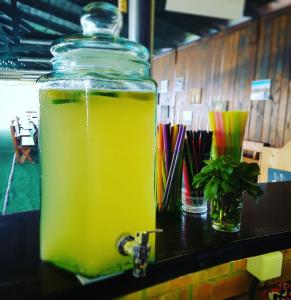 a glass jar filled with yellow liquid sitting on a counter at Satul de Vacanta Campo Euro Club in Partizanii
