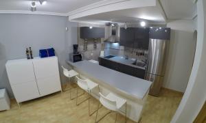 a kitchen with a white counter and a refrigerator at Cabo de Gata-Salinas-Almadraba in El Cabo de Gata