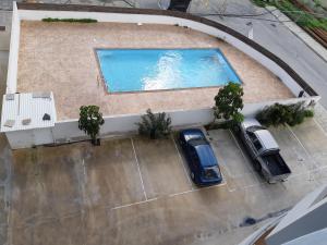 an overhead view of a swimming pool on a building at Vasilas Holiday Apartment #1 in Larnaka