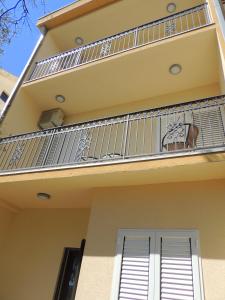 a balcony on a house with a horse on it at Guest House Jelena in Budva