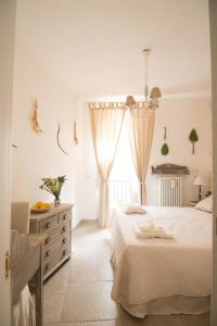 Lova arba lovos apgyvendinimo įstaigoje Manidibianco Apulian Relaxing Stay