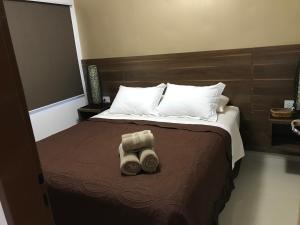 Ein Bett oder Betten in einem Zimmer der Unterkunft Ocio Apart