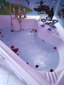 a bathtub filled with blood in a room at Affitto breve Spider-man house in Catania