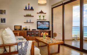 A television and/or entertainment centre at Platanias Sky View