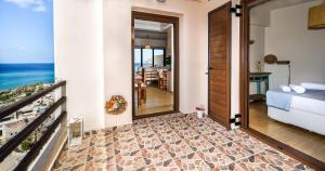A bed or beds in a room at Platanias Sky View