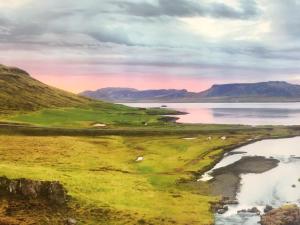 a painting of a golf course next to a body of water at Welcome Hotel Hellissandur by Snæfells Glacier National Park in Hellissandur