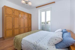 Ein Bett oder Betten in einem Zimmer der Unterkunft Apartment Lina