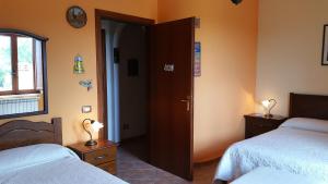 Postel nebo postele na pokoji v ubytování B&B A Robba de Pupi