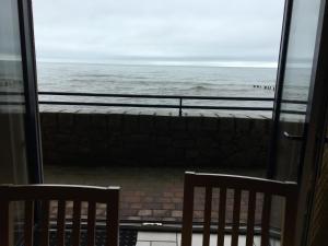 a view of the ocean from a balcony at B2 Waterfoot Apartment in Newcastle