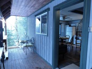 a room with a porch with a table and chairs at Packwood Ski & Vacation Getaway in Packwood