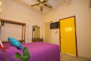 Кровать или кровати в номере Hotel Posada Santo Niño
