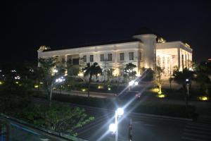 a white building with lights in front of it at night at Ngoc Trai 02 FLC Sam Son in Sầm Sơn