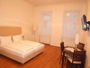 Postel nebo postele na pokoji v ubytování Apartment Nestroygasse