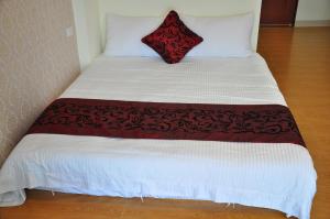 Postel nebo postele na pokoji v ubytování Four Seasons Homestay