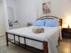Letto o letti in una camera di Villa Osumare Guest House