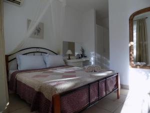 Letto o letti in una camera di Villa Osumare Guest House