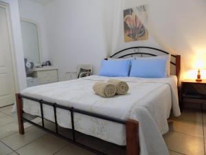 Letto o letti in una camera di Villa Osumare Guest House