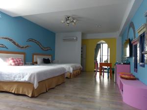 Postel nebo postele na pokoji v ubytování Sky Blue Ocean B&B