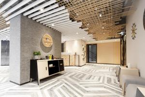 Ein Bett oder Betten in einem Zimmer der Unterkunft Hotel Ease Access Tsuen Wan