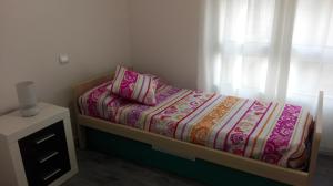 A bed or beds in a room at Pisazo calle Peatonal en el centro!