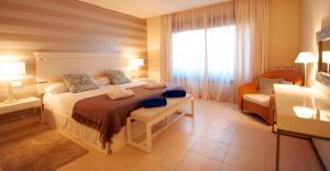 Posteľ alebo postele v izbe v ubytovaní Aparthotel Novo Resort