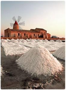 a pile of snow in front of a building with a windmill at Mergellina 10 in Marsala