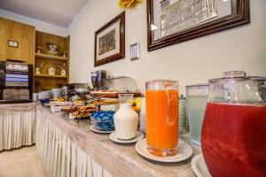 two drinks sitting on a counter in a restaurant at Hotel Tiziana in Rimini