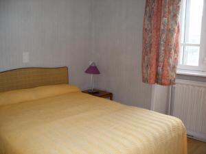 Postel nebo postele na pokoji v ubytování Hôtel Modern
