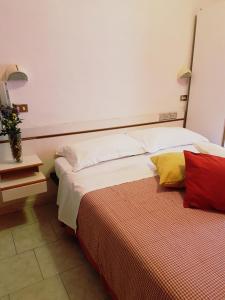 Postel nebo postele na pokoji v ubytování Hotel Giannella