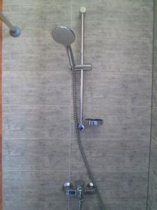 a shower in a bathroom with a glass door at Arena,VIP in Kyiv +27 photos