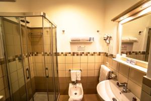 Koupelna v ubytování Hotel Oriente