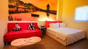 Letto o letti in una camera di Sabai B&B 澎湖船家寶民宿