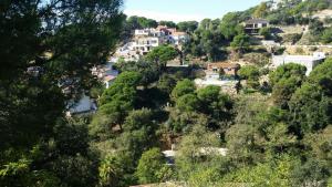 a village on a hill with houses at Morisca in Lloret de Mar