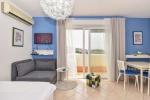 a living room with a couch and a table at Apartment Mirna in Makarska
