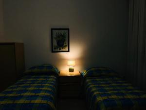 Ένα ή περισσότερα κρεβάτια σε δωμάτιο στο Casa Vacanze Basilicata da Giannino