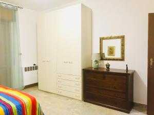 Ένα ή περισσότερα κρεβάτια σε δωμάτιο στο Casa Vacanze Basilicata da Giannino