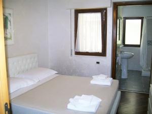 Postel nebo postele na pokoji v ubytování B&B Villa Garden