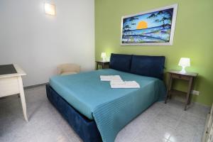 A bed or beds in a room at B&B Villa Genny a pochi passi dal mare