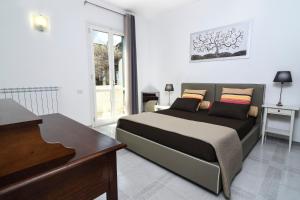 A bed or beds in a room at B&B Villa Genny a pochi passi dal mare